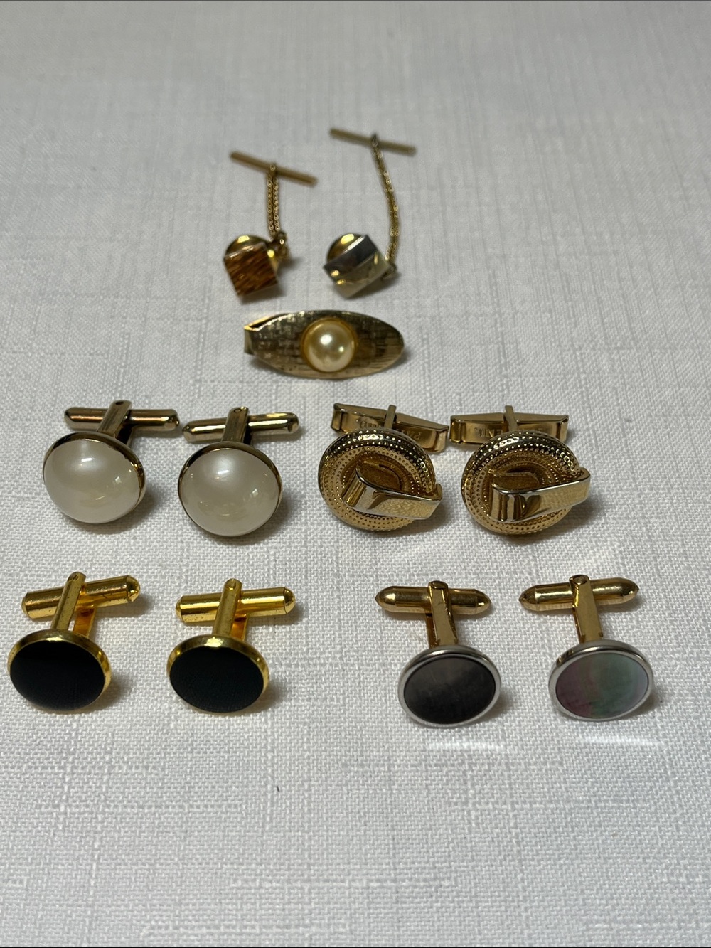Four pair vintage cufflinks, one tie clip and two tie tacks
Retro